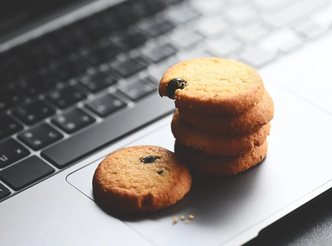 internet cookies, mini cookies on keyboard computer laptop for internet browser cookies concept